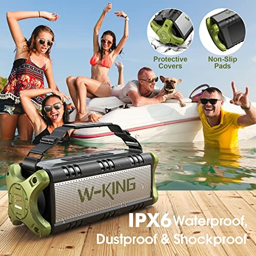 People enjoying music with a waterproof speaker by a boat.