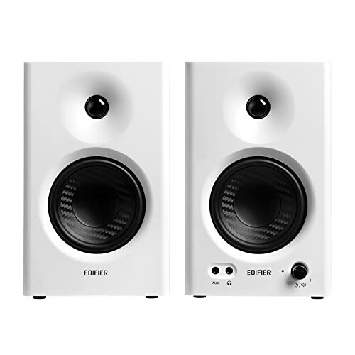 Pair of white Edifier stereo speakers with volume control.